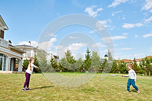 Kids Playing Badminton in Front Yard