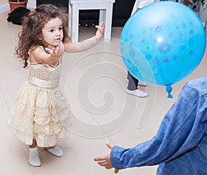 Kids playing balloon at home