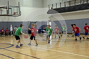 Kids playing basketball match