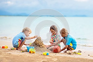 Kids playing on beach. Children play at sea