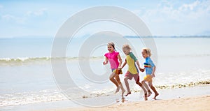 Kids playing on beach. Children play at sea