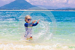 Kids playing on beach. Children play at sea