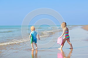 Kids playing on beach. Children play at sea