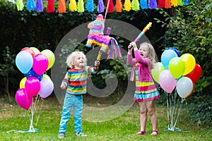 Kids playing with birthday pinata