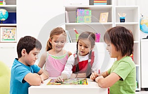 Kids playing board game in their room