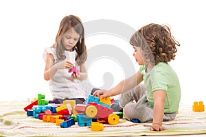 Kids playing with bricks toys