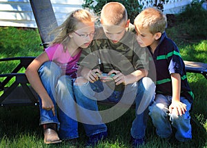 Kids playing on cell phone