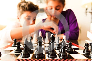 Kids playing Chess photo