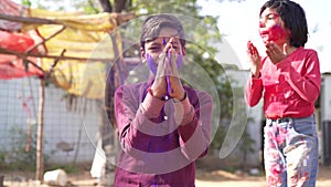 Kids playing with color at home During holi Festival of Colors