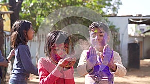 Kids playing with color at home During holi Festival of Colors