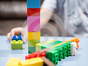 Kids playing with color toy blocks