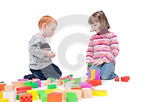 Kids playing with colorful blocks