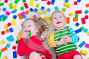 Kids playing with colorful blocks