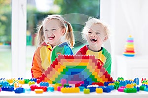 Kids playing with colorful blocks