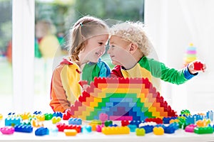 Kids playing with colorful blocks