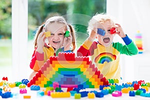 Kids playing with colorful blocks