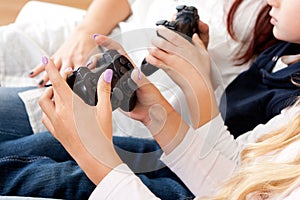 Kids playing console games using joystick