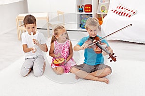 Kids playing on different musical instruments