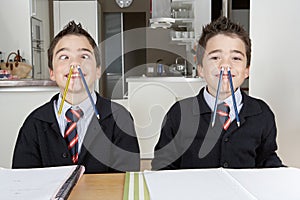 Kids playing while doing homework at home