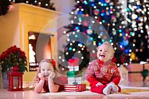 Kids playing at fireplace on Christmas eve