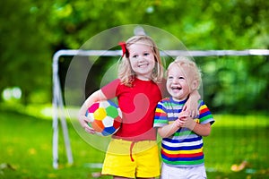 Kids playing football in a park