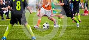 Kids Playing Football Soccer Game on Sports Field. Boys Play Soccer Match on Green Grass. Youth Soccer Tournament Teams Competitio