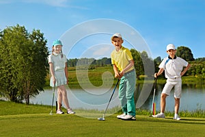 Kids playing golf