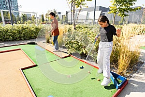 Kids playing golf inside playground artificial grass activity game for children