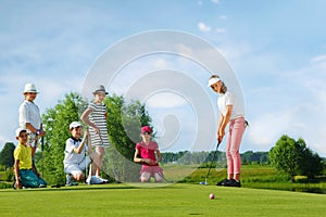 Kids playing golf img