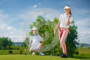 Kids playing golf img