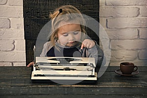 Kids playing - happy game. business kid or small boy or businessman child with typewriter