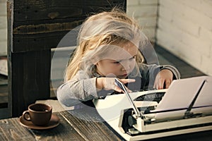 Kids playing - happy game. child or small boy or businessman kid with typewriter