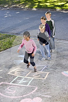 Kids playing hopscotch