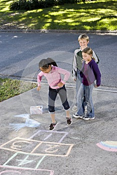 Kids playing hopscotch