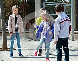 Kids playing in jump rope game