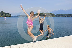 Kids playing at the lake on their summer vacation