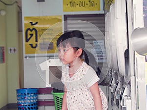 Kids playing in the laundry store