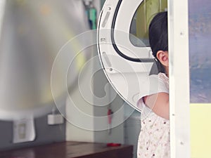 Kids playing in the laundry store