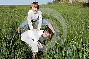 Kids playing leapfrog