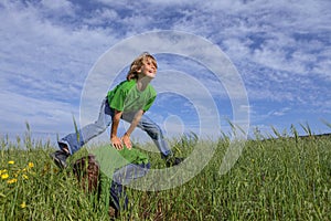 Kids playing leapfrog summer game