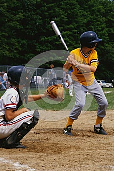 Kids playing in a little league baseball game