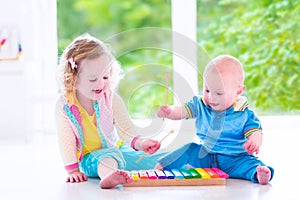 Kids playing music with xylophone