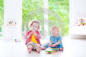 Kids playing music with xylophone