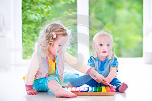 Kids playing music with xylophone