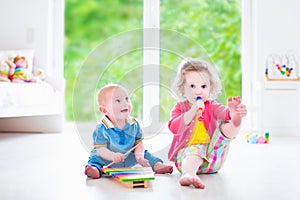 Kids playing music with xylophone