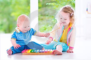 Kids playing music with xylophone photo