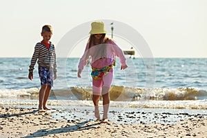 Kids playing outdoor on beach.