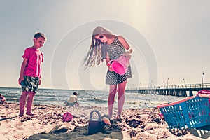Kids playing outdoor on beach.