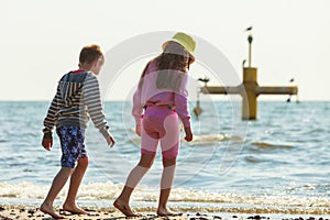 Kids playing outdoor on beach.