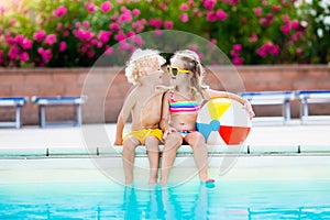 Kids playing at outdoor swimming pool